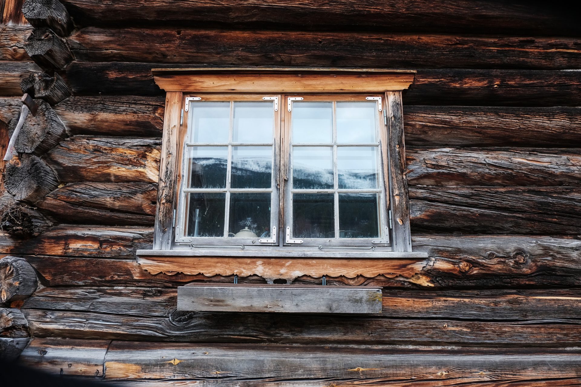 Window on the side of a rustic cabin