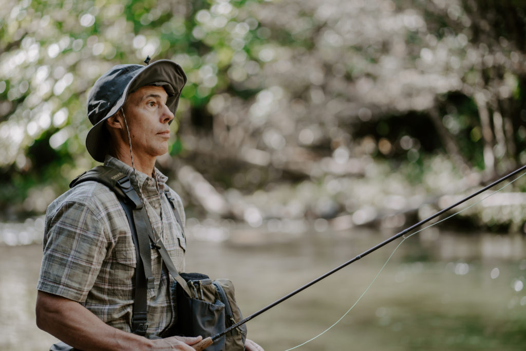 Lifestyle photography of a man fly fishing in the Little River in Townsend, TN.