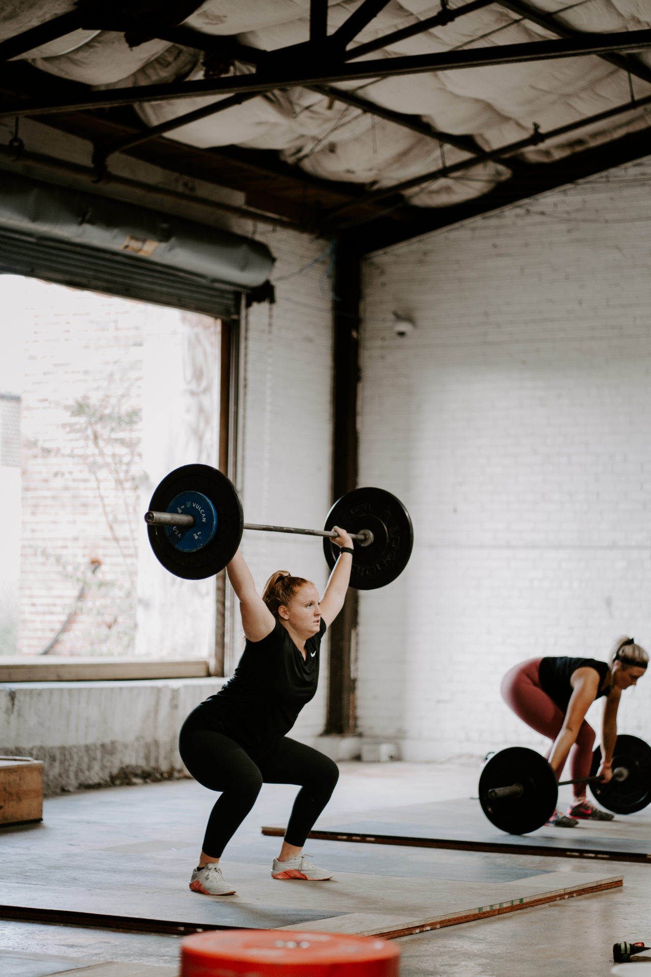 Commercial photography of a woman weightlifting at Rocky Top CrossFit.
