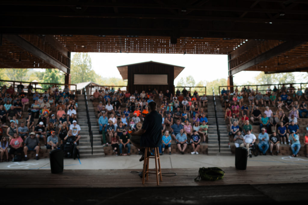 Event photography of a crowd listening to a presentation at the Smoky Mountain Bigfoot Festival.