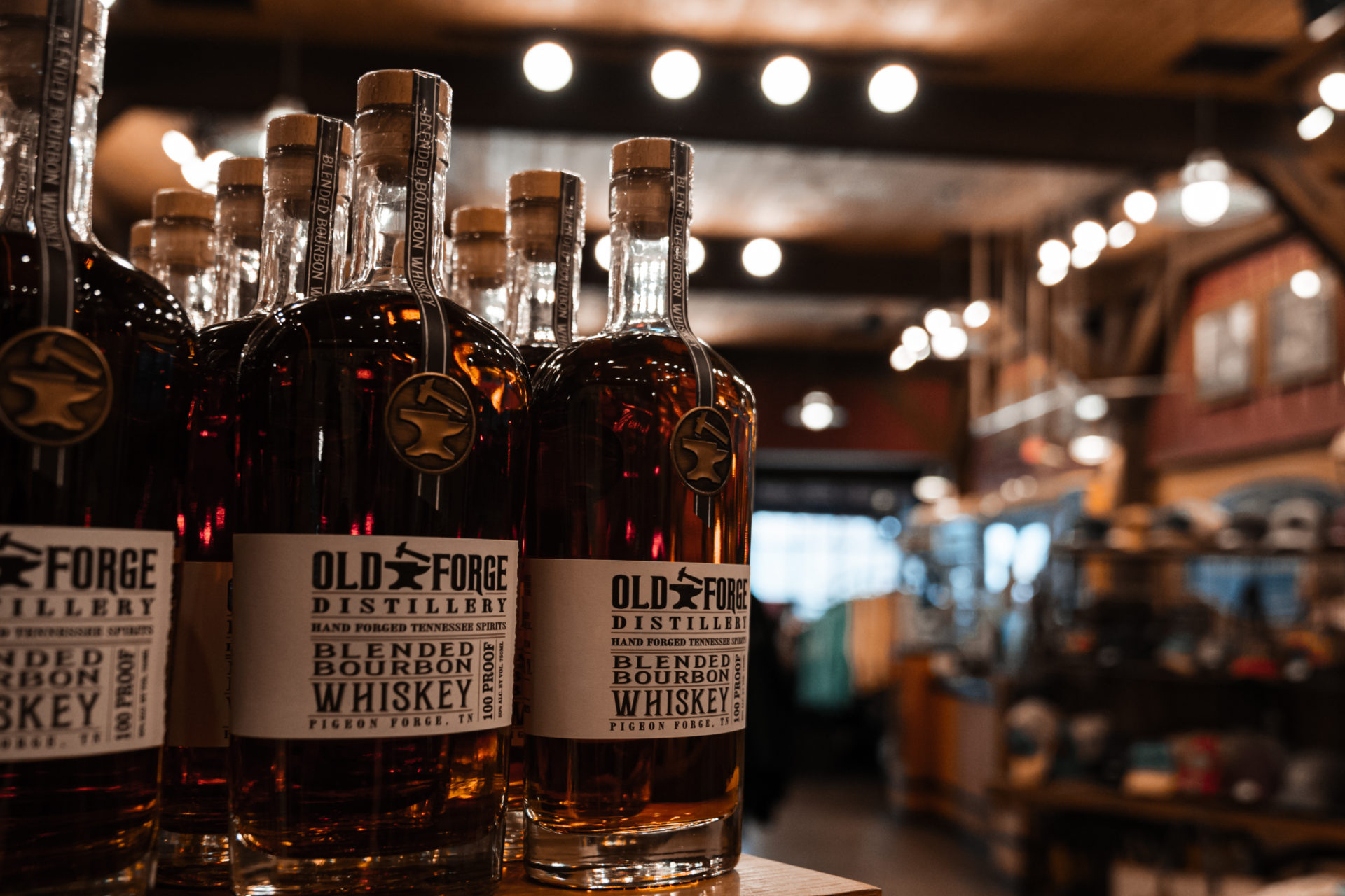 Product photography of Old Forge Distillery whiskey bottles sitting in their store.