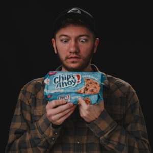 Bryce Boser holding a pack of Chips Ahoy cookies