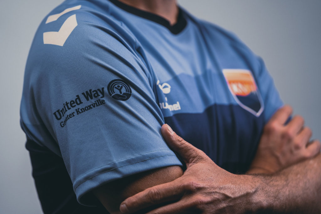 Close-up product photography of OneKnox kit reveal shirt.