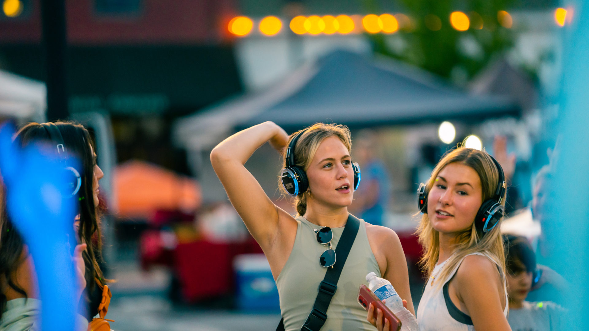 Event photography of three women dancing at a silent disco in Maryville, TN.