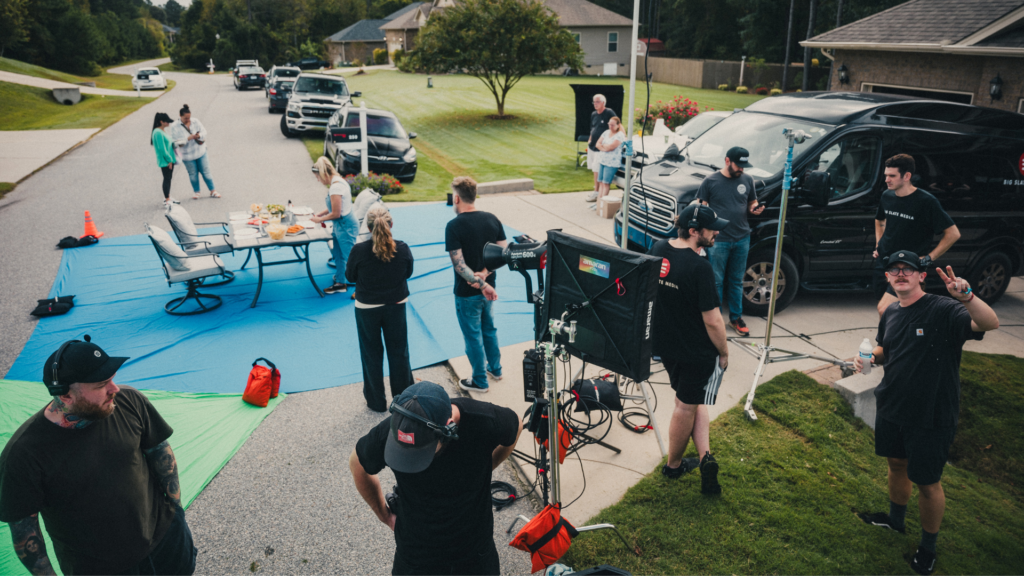 The Big Slate Media crew on a production set with large green screens